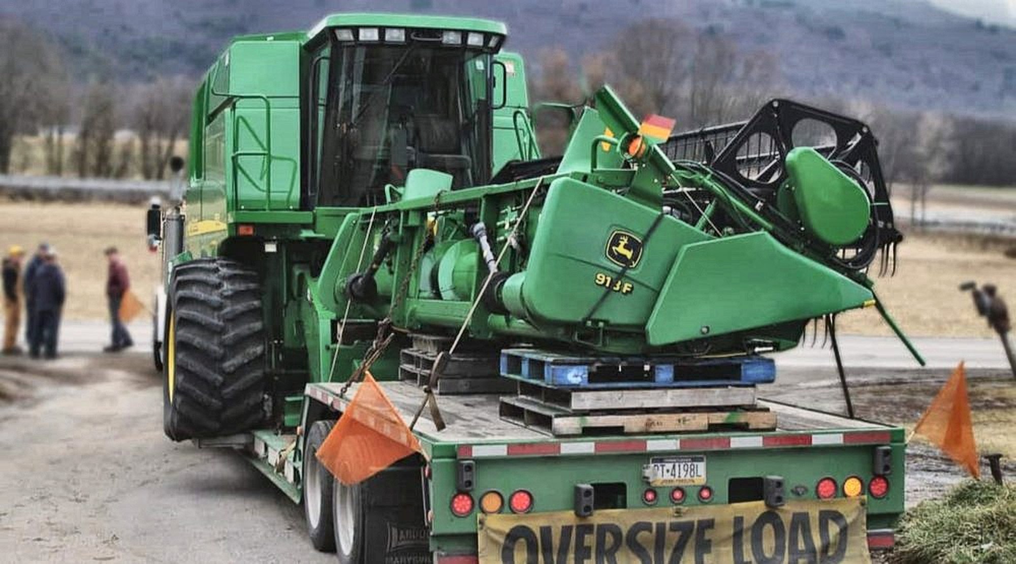 Oversized transport — combine harvester on a low-loader